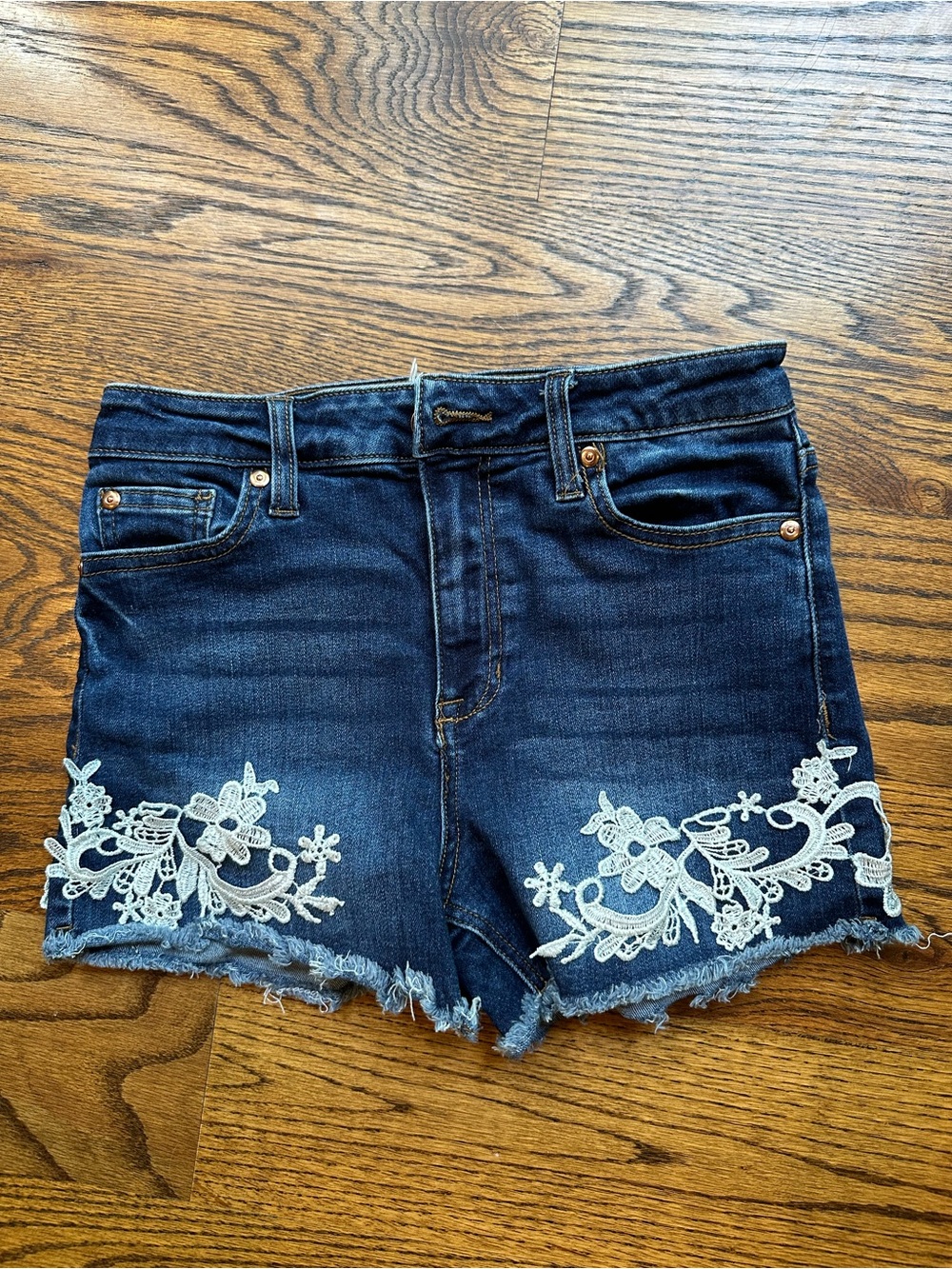 Alter’d State Dark Wash Denim Shorts with White Floral Lace Appliqué